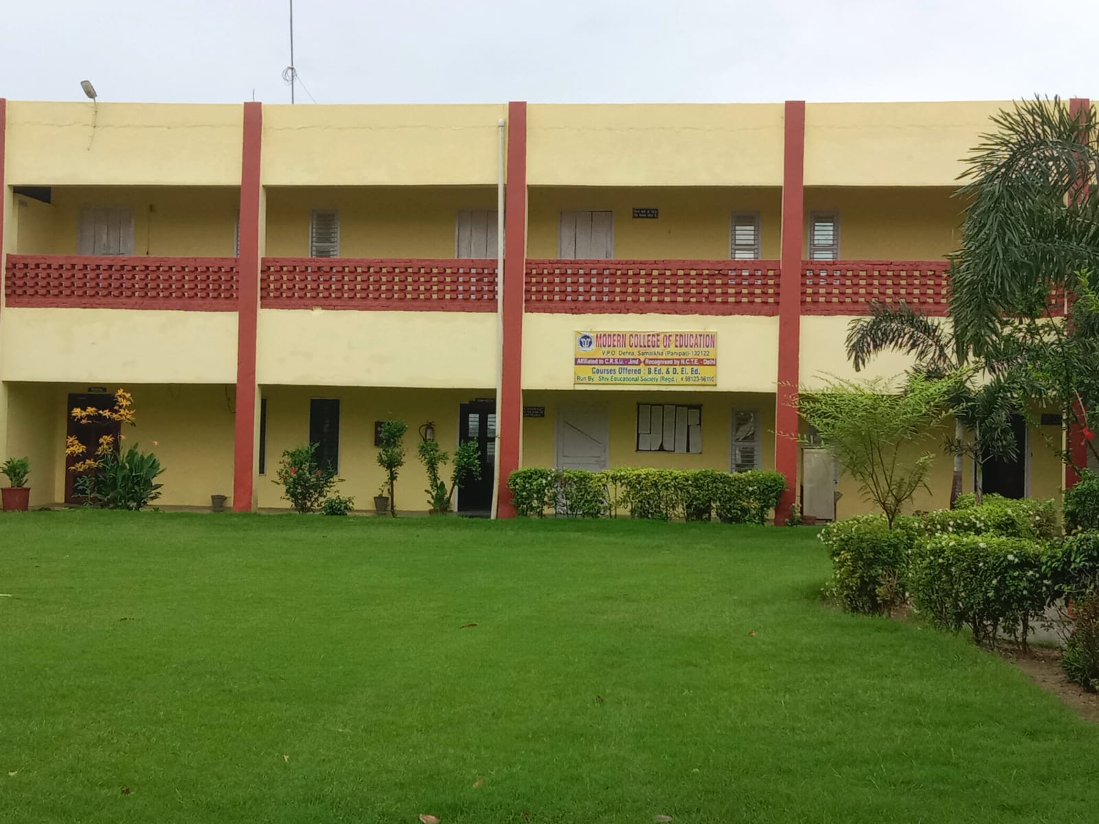 Modern College of Education campus building and lawn